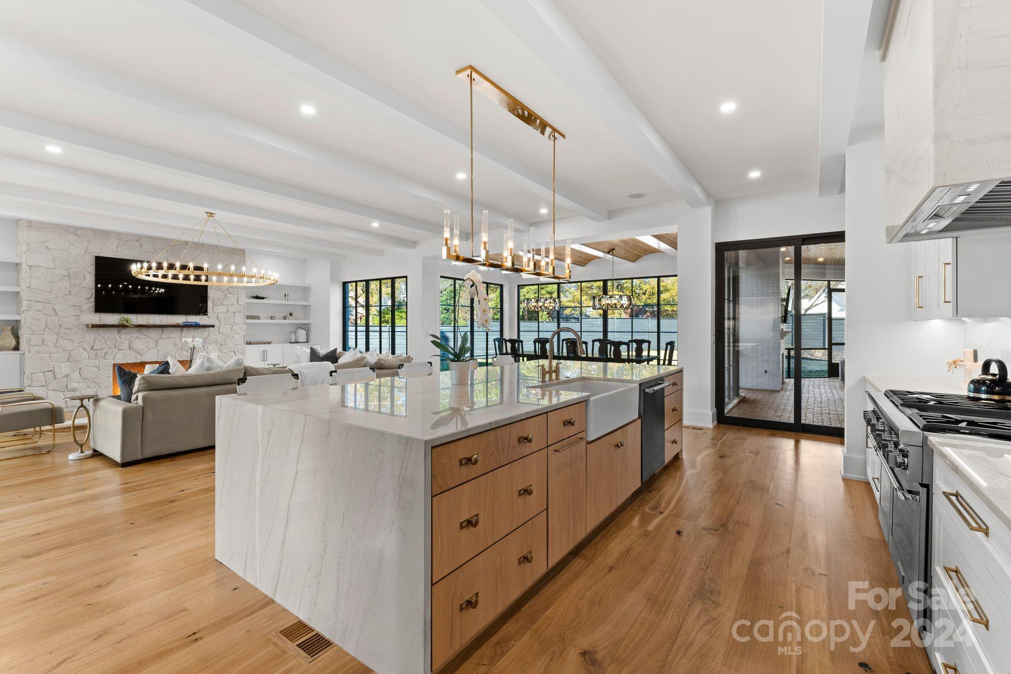 20218 Rainbow Circle Cornelius, NC 28031 - Photo 12 of 44 a large kitchen with stainless steel appliances kitchen island granite countertop a large counter top stainless steel appliances and cabinets