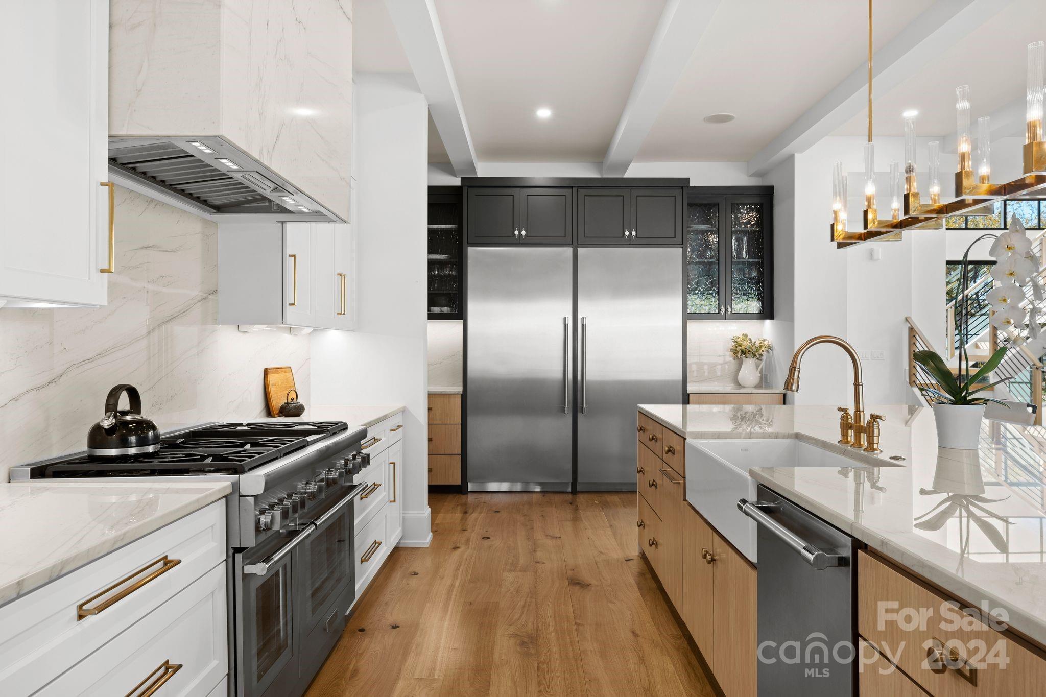 20218 Rainbow Circle Cornelius, NC 28031 - Photo 13 of 44 a kitchen with granite countertop a sink stainless steel appliances and cabinets