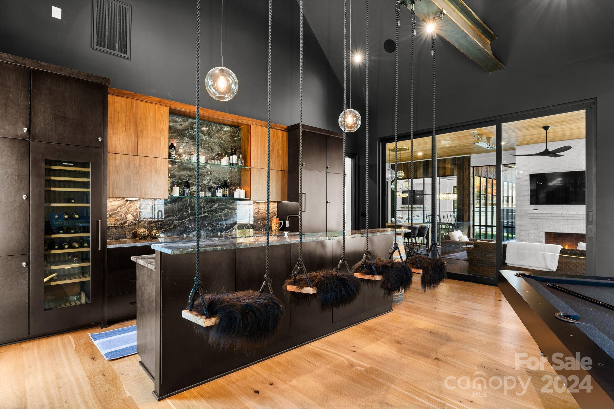 20218 Rainbow Circle Cornelius, NC 28031 - Photo 20 of 44 a living room with furniture a large window and stainless steel appliances