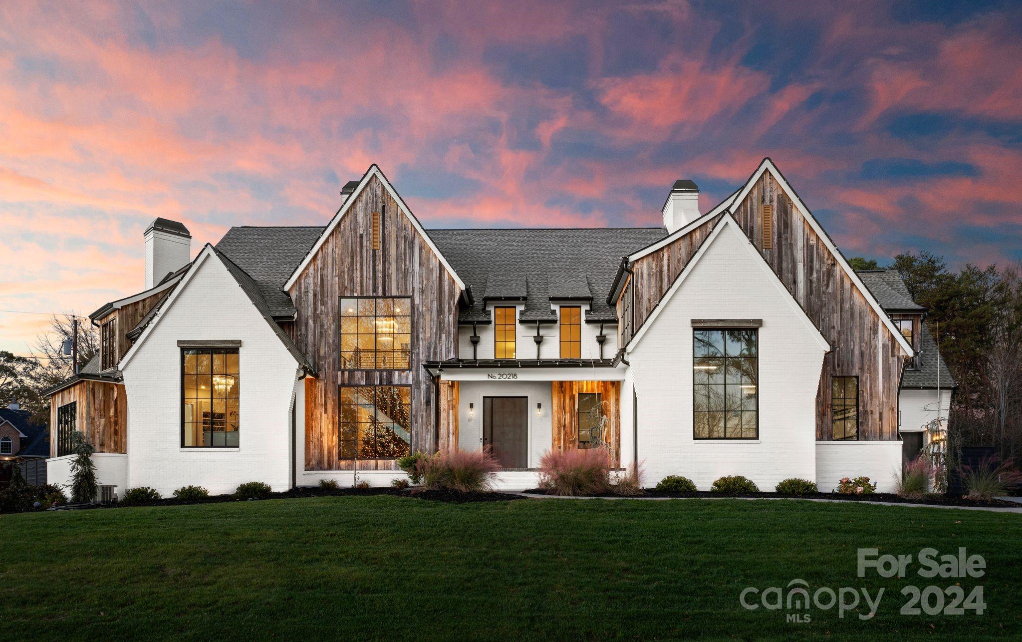 20218 Rainbow Circle Cornelius, NC 28031 - Photo 2 of 44 a front view of a house with a yard
