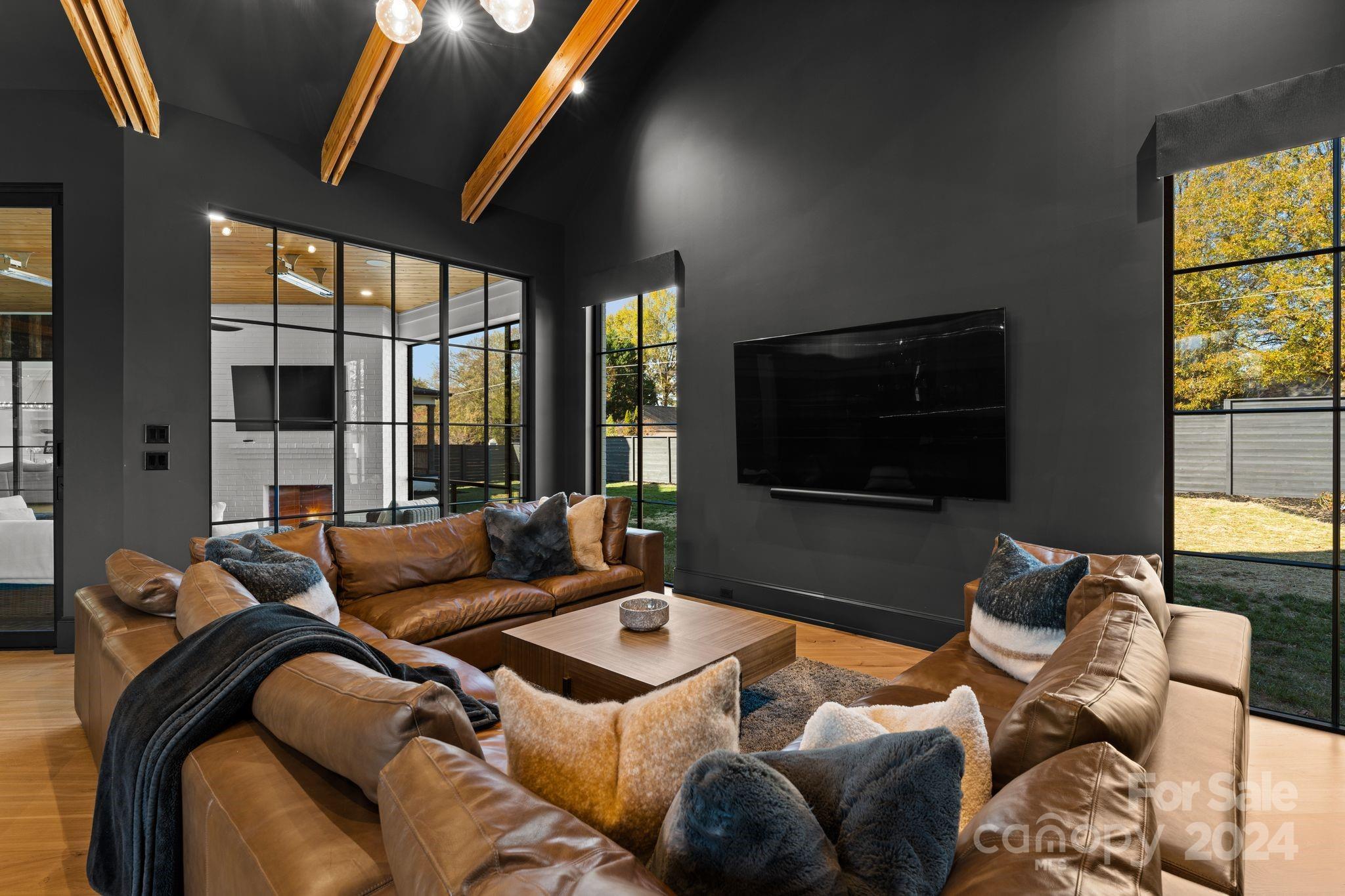 20218 Rainbow Circle Cornelius, NC 28031 - Photo 23 of 44 a living room with furniture and a flat screen tv