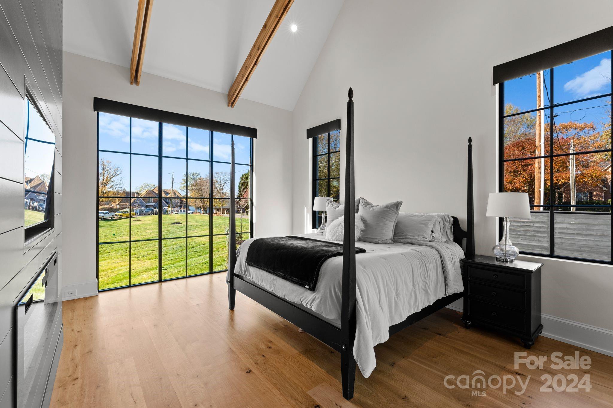 20218 Rainbow Circle Cornelius, NC 28031 - Photo 27 of 44 a spacious bedroom with a bed and a large window