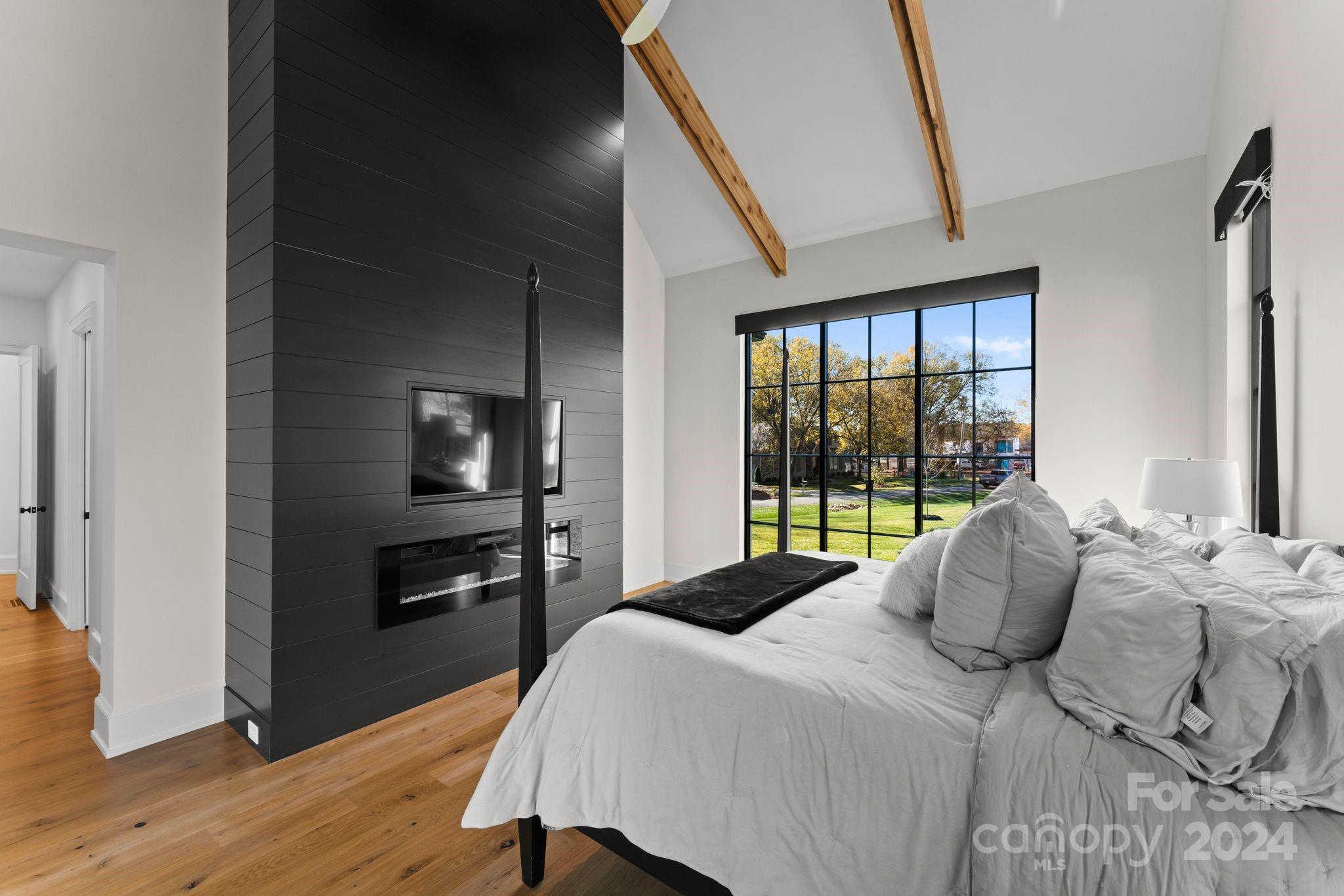 20218 Rainbow Circle Cornelius, NC 28031 - Photo 28 of 44 a bedroom with a bed and a large window
