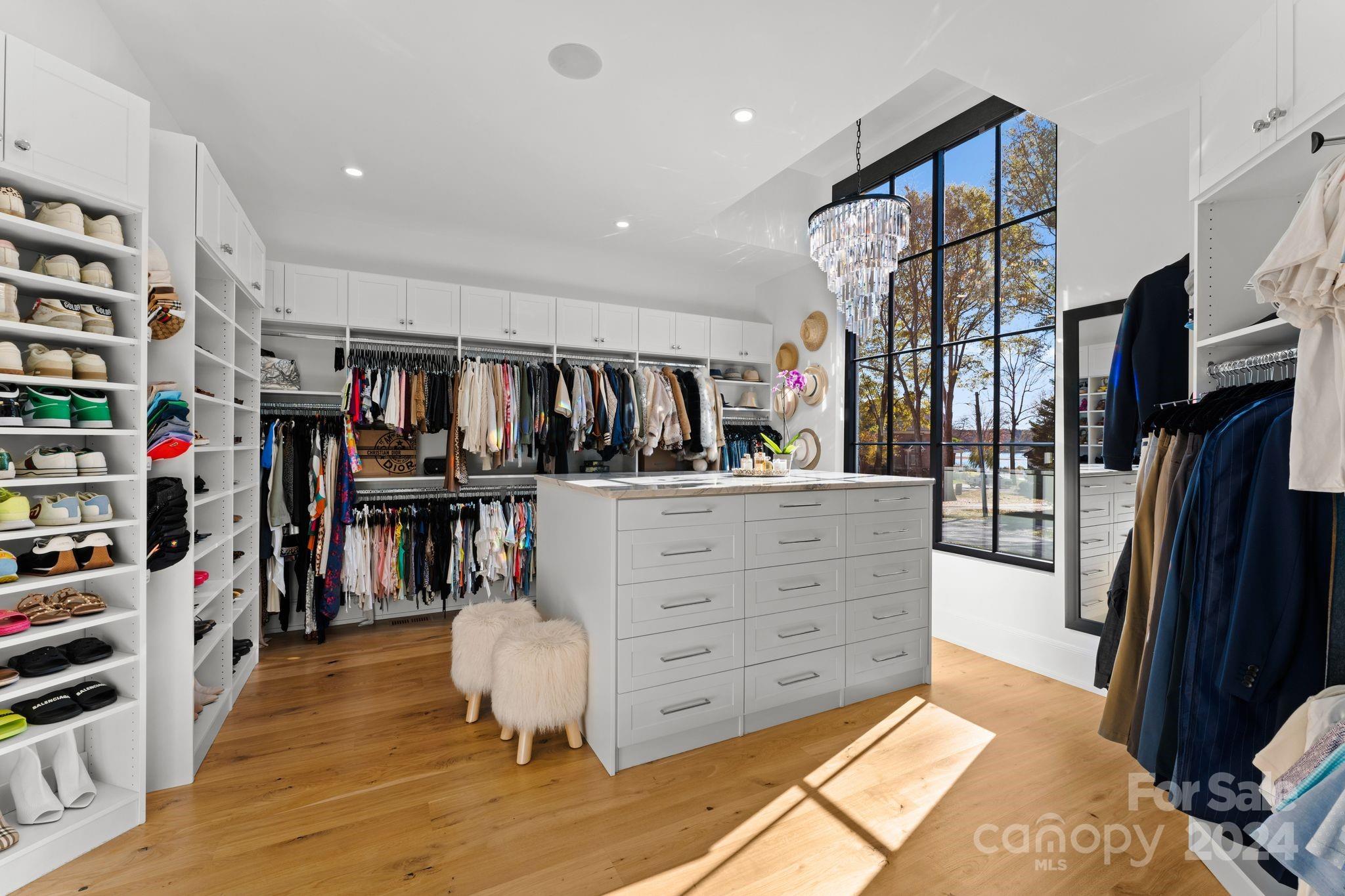 20218 Rainbow Circle Cornelius, NC 28031 - Photo 30 of 44 a view of walk in closet with clothes and shoes