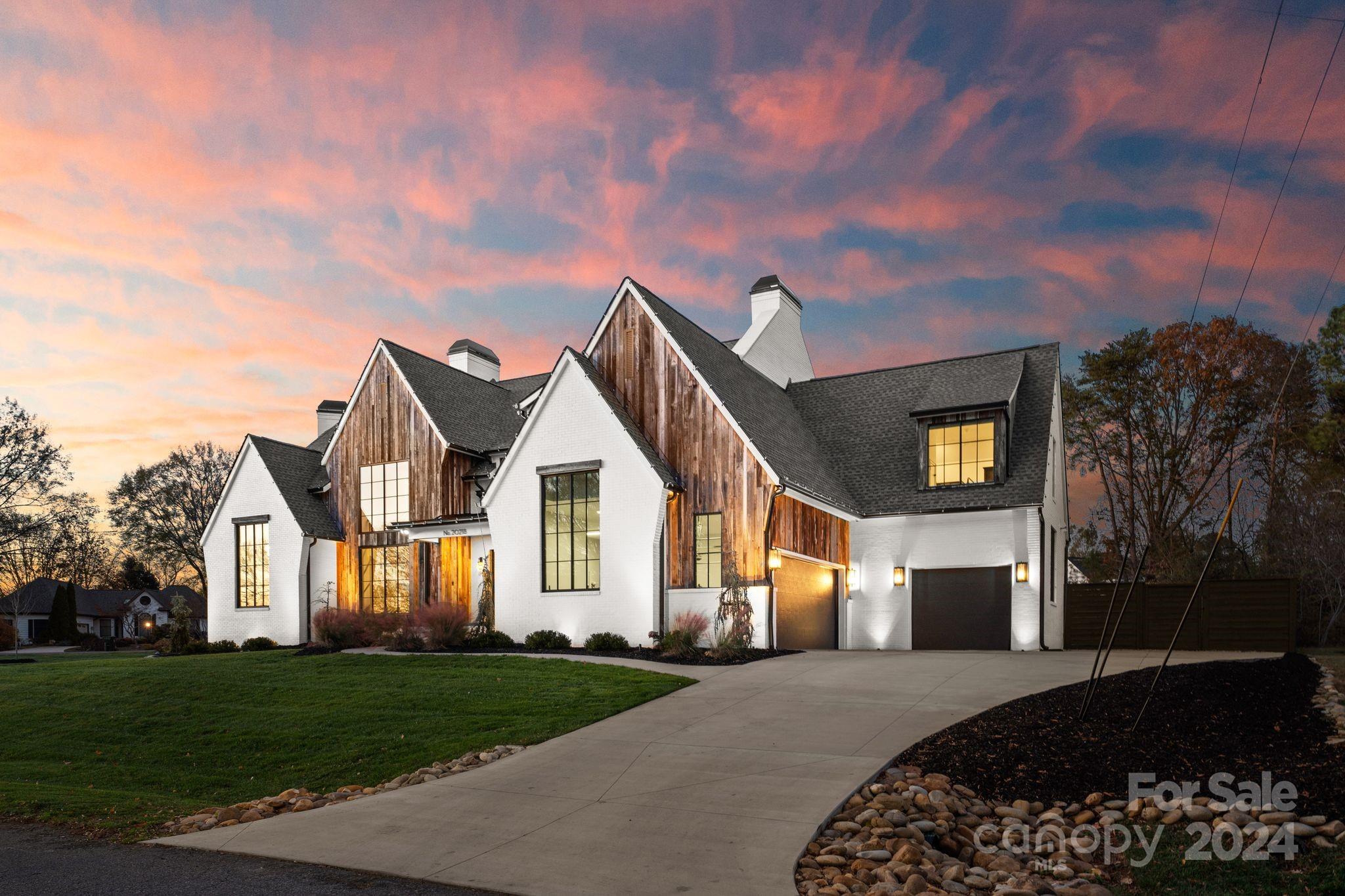 20218 Rainbow Circle Cornelius, NC 28031 - Photo 3 of 44 a front view of a house with a yard