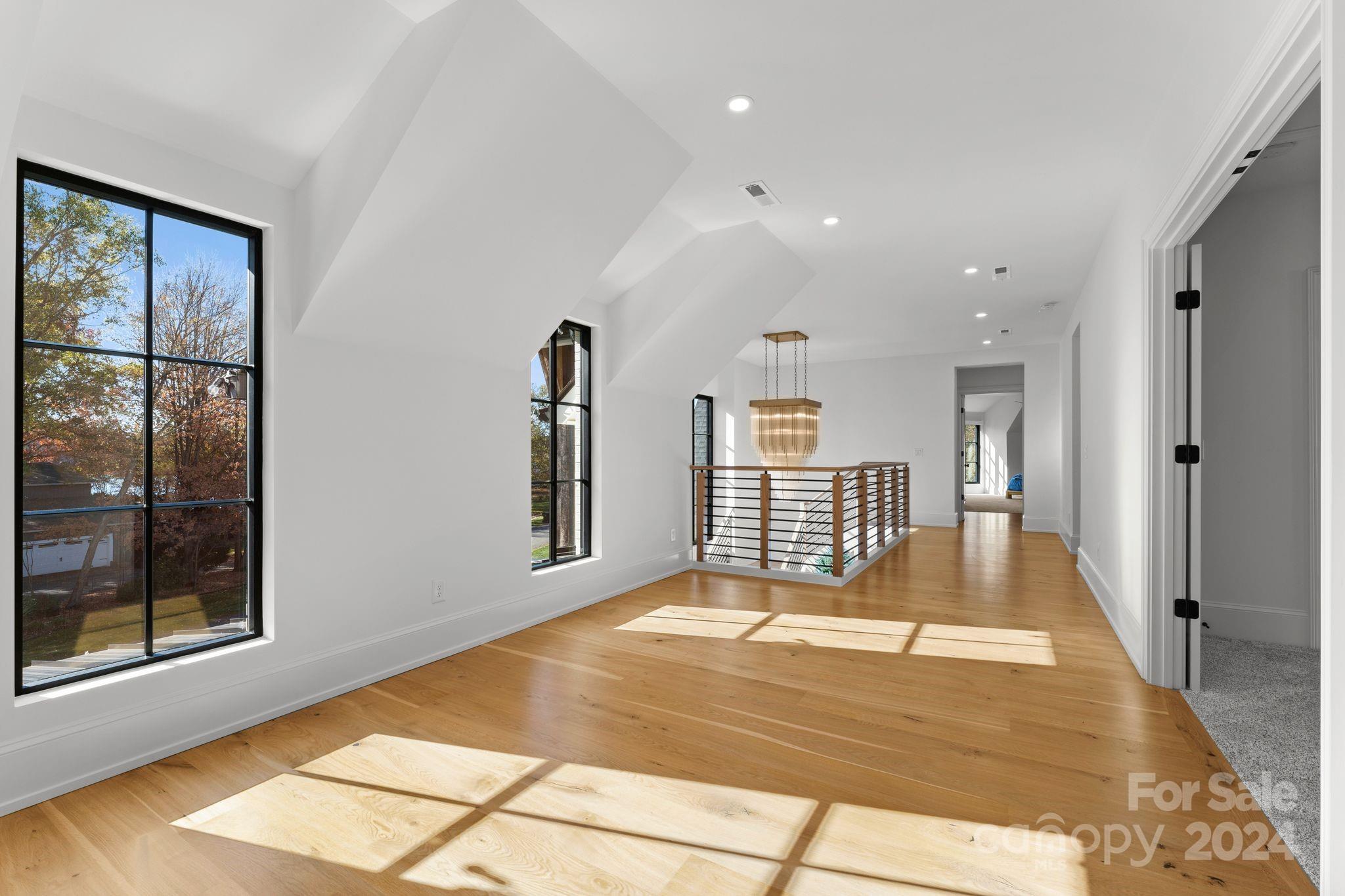 20218 Rainbow Circle Cornelius, NC 28031 - Photo 32 of 44 a view of an empty room with a window and a fireplace