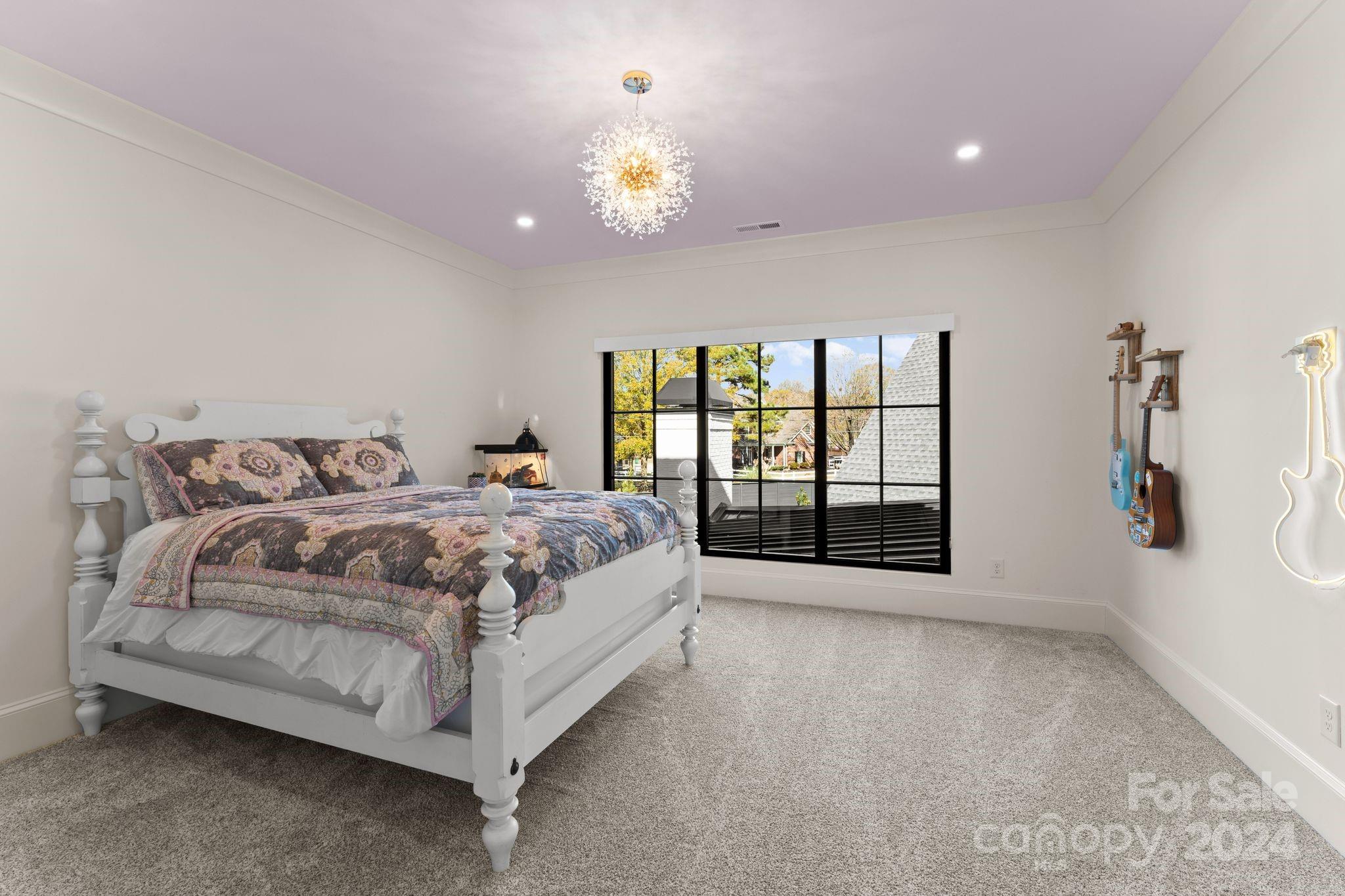 20218 Rainbow Circle Cornelius, NC 28031 - Photo 36 of 44 a spacious bedroom with a bed and a large window