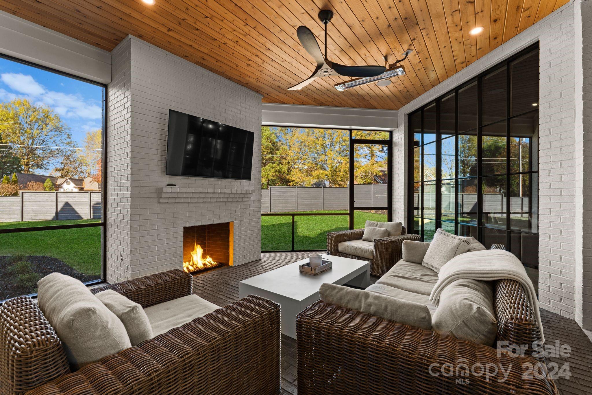 20218 Rainbow Circle Cornelius, NC 28031 - Photo 40 of 44 a bedroom with furniture a large window and a fireplace