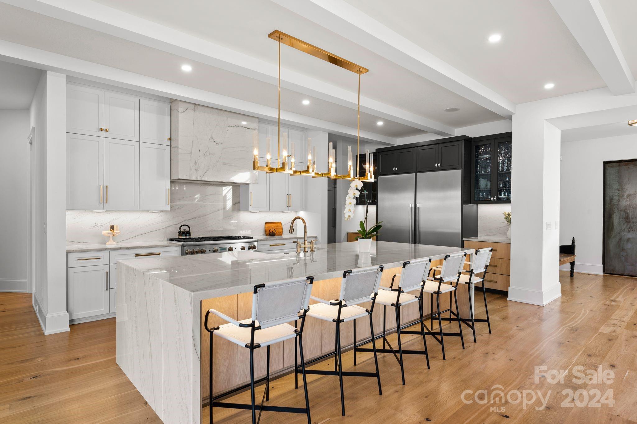 20218 Rainbow Circle Cornelius, NC 28031 - Photo 9 of 44 a kitchen with cabinets and chairs