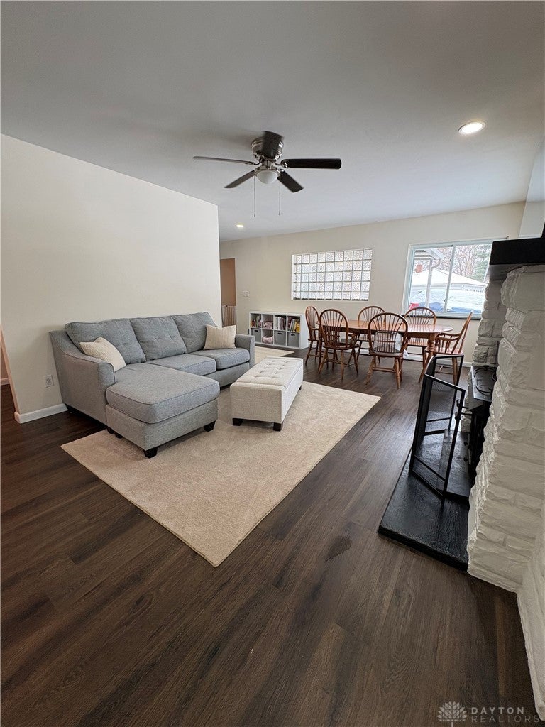 1513 Ridgeway Drive Springfield, OH 45506 - Photo 26 of 53 This inviting space offers a comfortable living area, a fireplace, and an arched entryway perfect for relaxation and everyday gatherings.