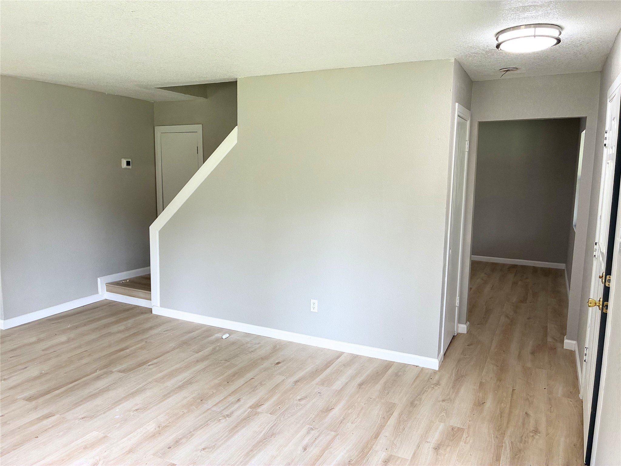 117 Amanda Street Conroe, TX 77304 - Photo 8 of 35 a view of hallway with wooden floor
