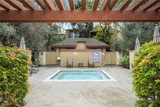 a front view of a house with a yard table and chairs