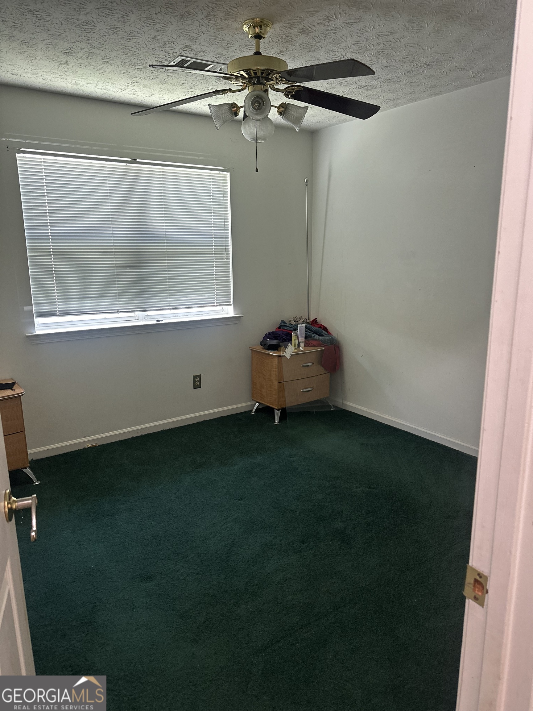 1616 Cobbs Creek Lane Decatur, GA 30032 - Photo 6 of 12 a room with cabinets and a window
