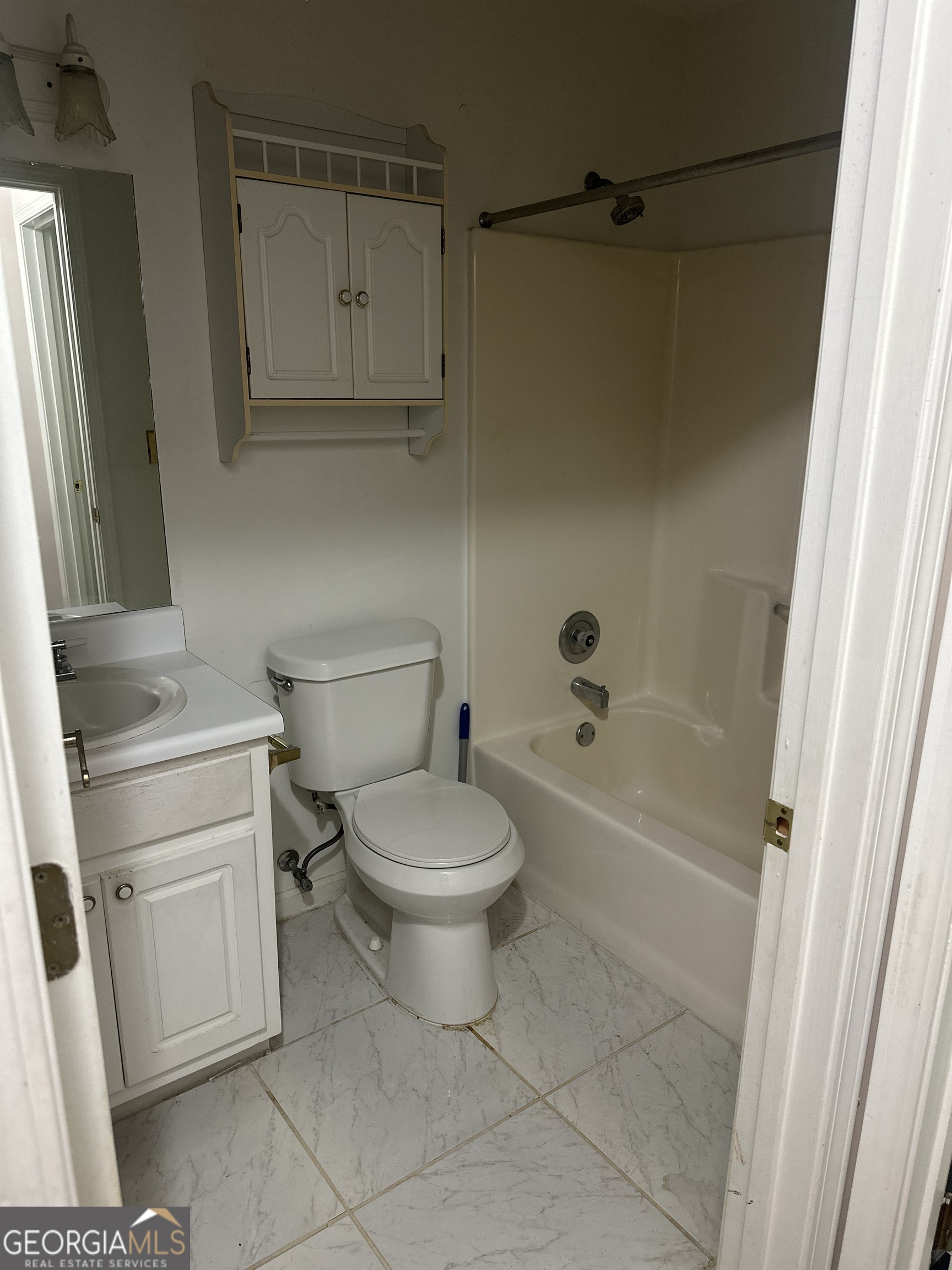 1616 Cobbs Creek Lane Decatur, GA 30032 - Photo 7 of 12 a bathroom with a toilet and a shower