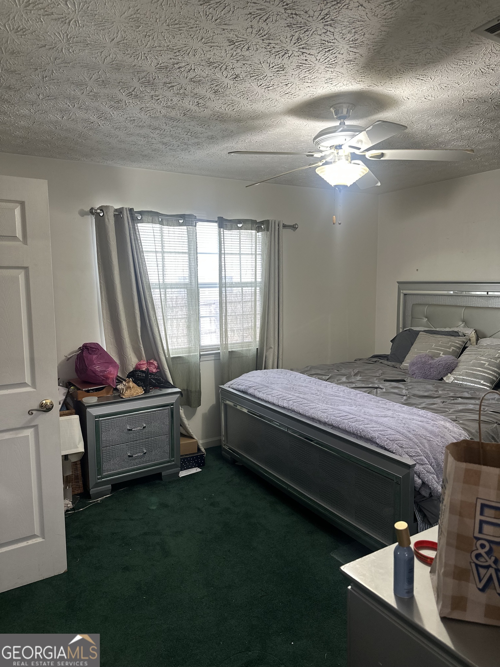 1616 Cobbs Creek Lane Decatur, GA 30032 - Photo 8 of 12 a bedroom with a bed and window