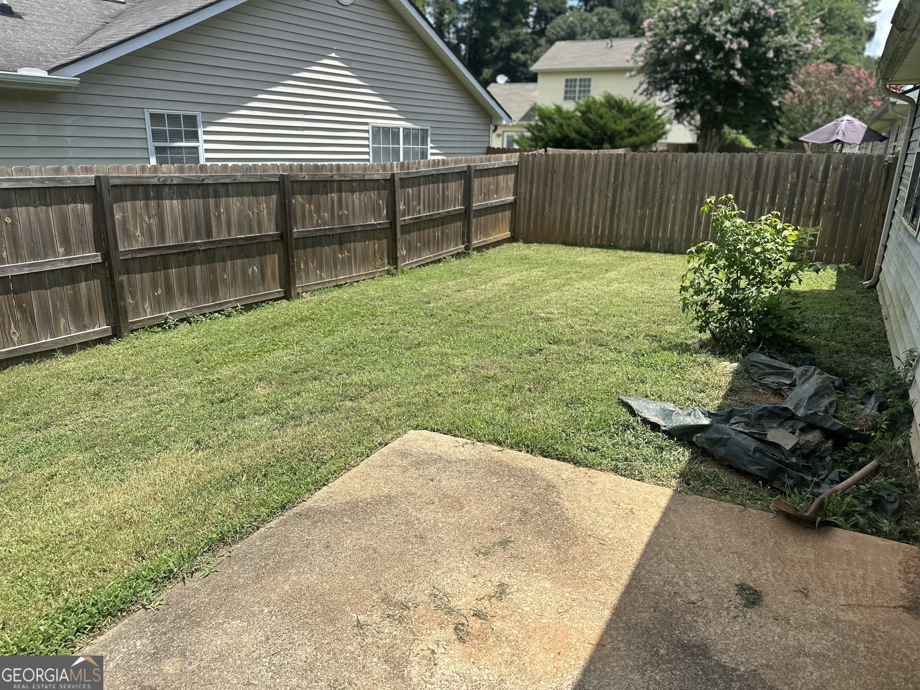 1616 Cobbs Creek Lane Decatur, GA 30032 - Photo 9 of 12 a view of a backyard with wooden fence