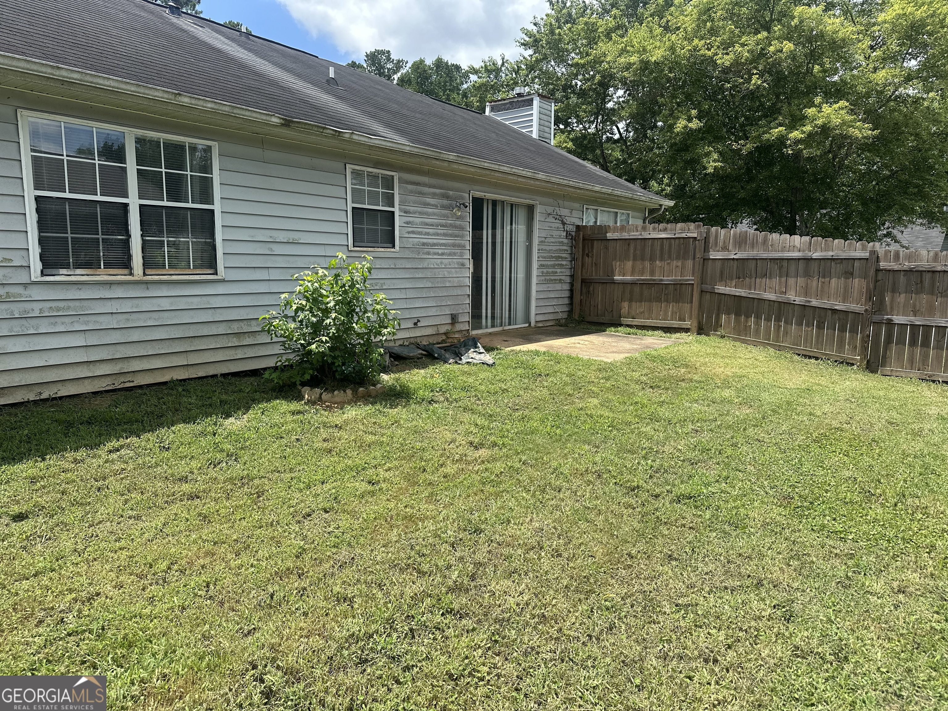 1616 Cobbs Creek Lane Decatur, GA 30032 - Photo 10 of 12 a view of a backyard with a garden