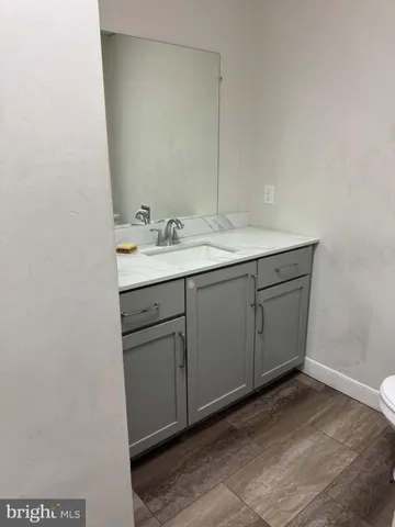 a bathroom with a sink and mirror