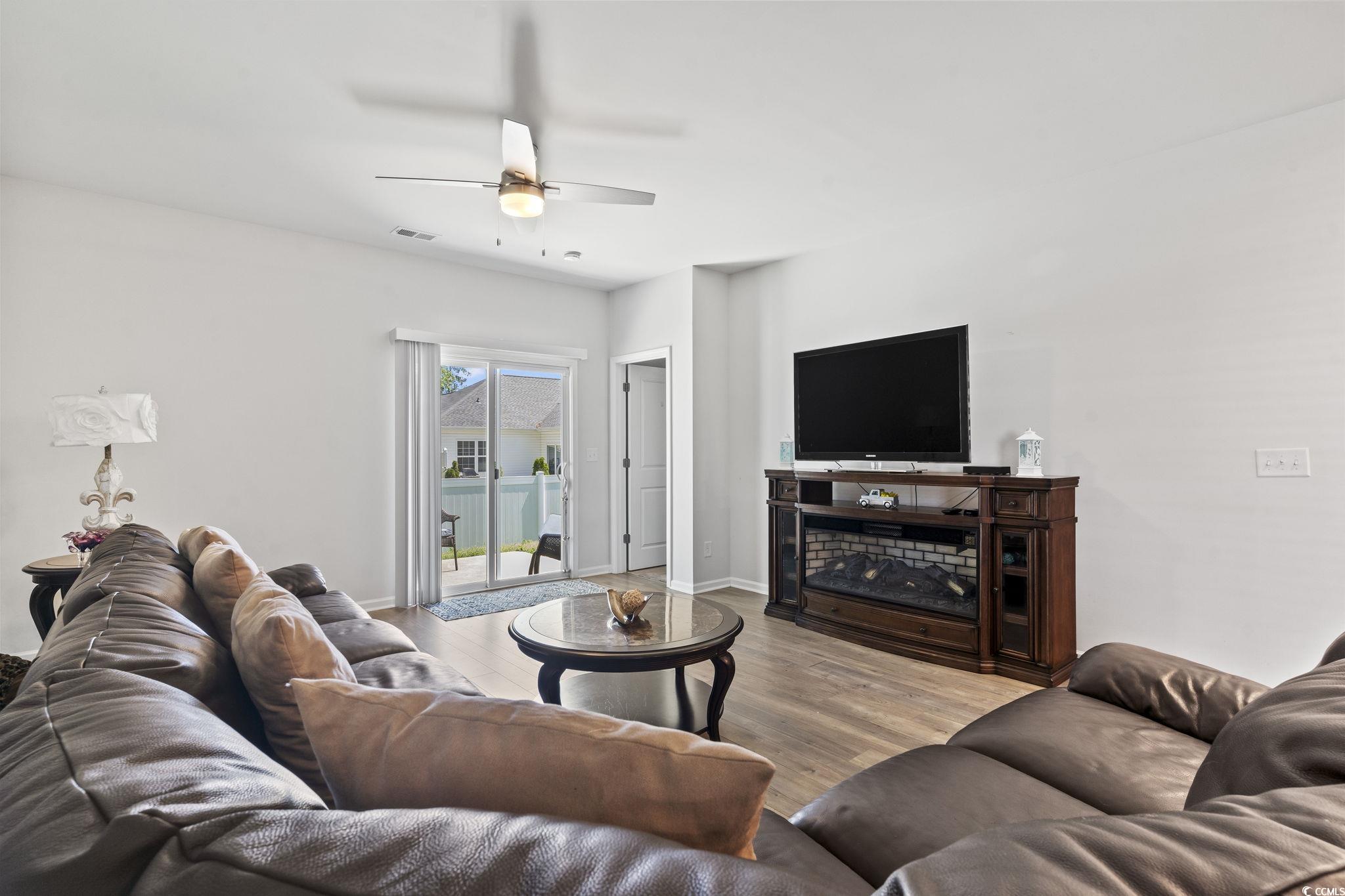 148 Reindeer Road South Surfside Beach, SC 29575 - Photo 11 of 38 Living room featuring wood finished floors, visibl