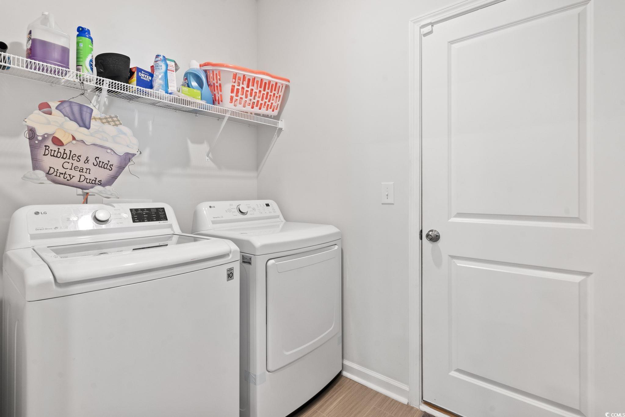 148 Reindeer Road South Surfside Beach, SC 29575 - Photo 7 of 38 Laundry area with baseboards, light wood-style flo