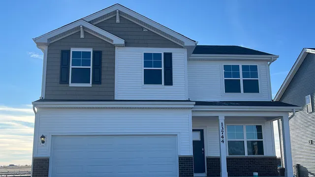 a living room with furniture a table and a potted plant