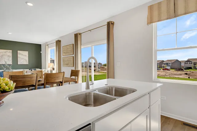 a kitchen with a sink and a refrigerator