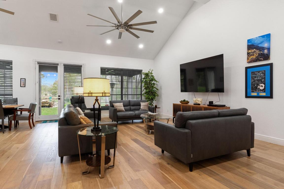346 The Oaks Boulevard Elgin, TX 78621 - Photo 6 of 39 a living room with furniture and a flat screen tv