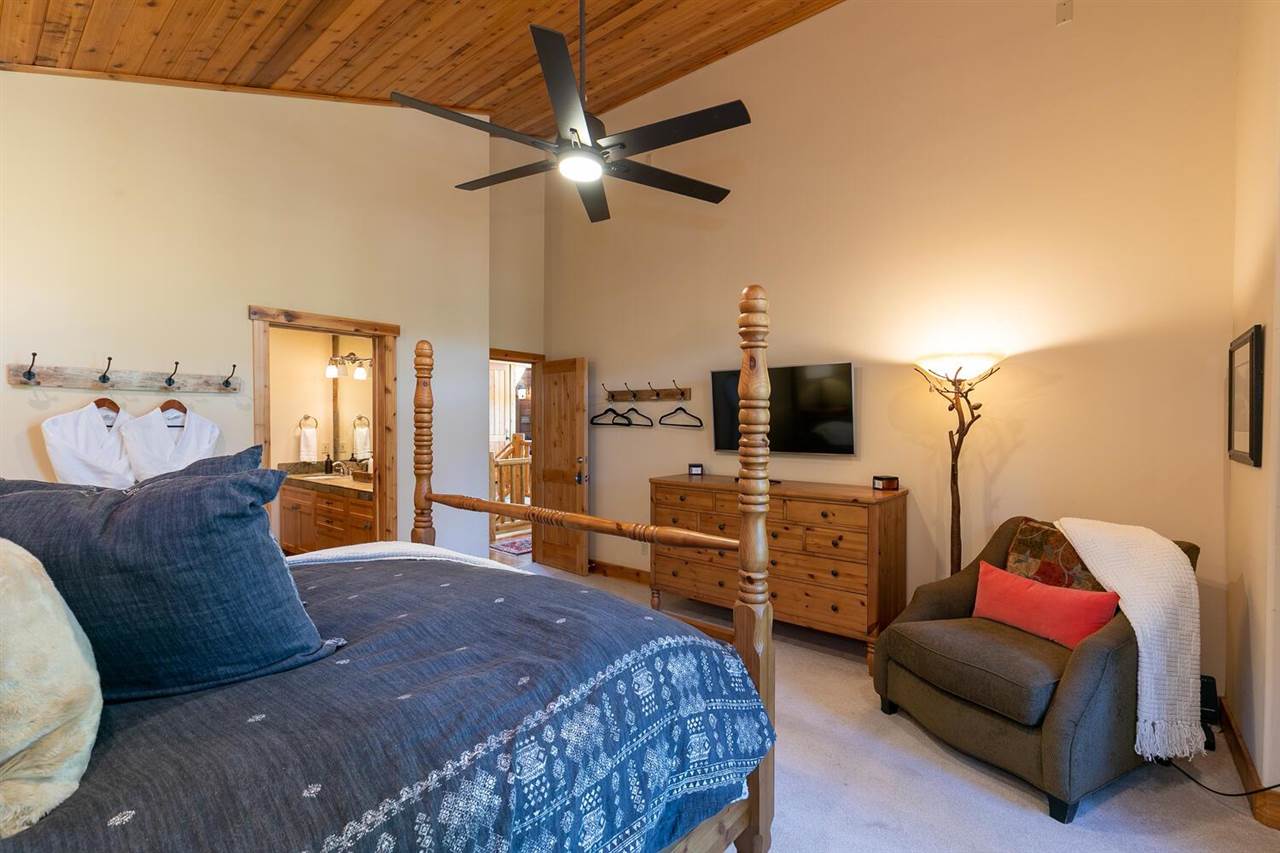 1755 Grouse Ridge Road Truckee, CA 96161 - Photo 10 of 20 a spacious bedroom with a bed and furniture