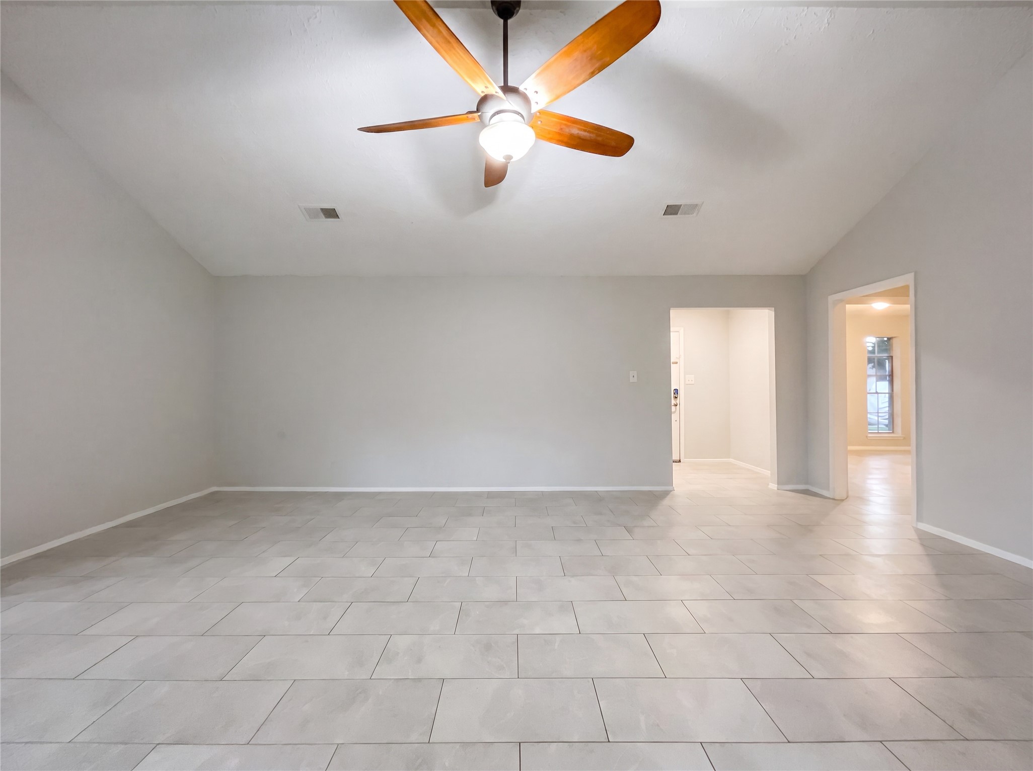 23110 Pennsgrove Road Spring, TX 77373 - Photo 8 of 16 an empty room with fan and windows
