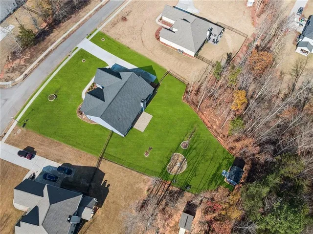 an aerial view of a house with a garden