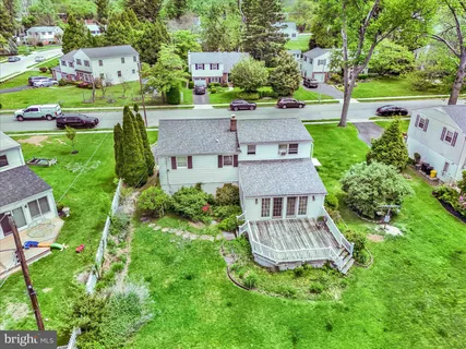 an aerial view of a house with a garden