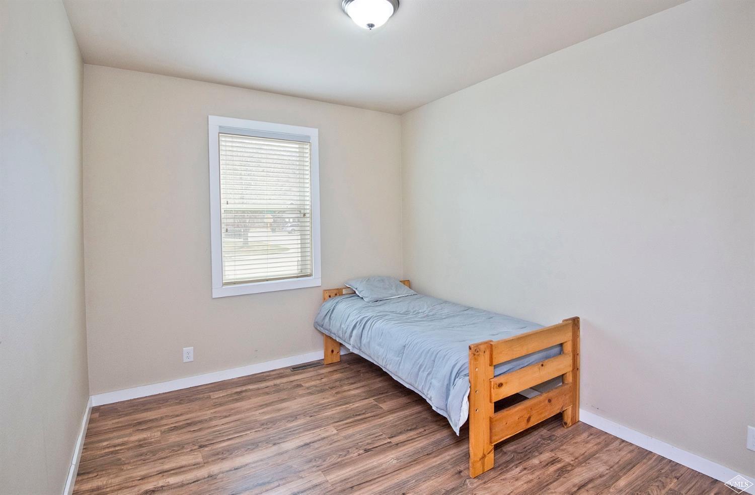 10 Salmon Loop Gypsum, CO 81637 - Photo 13 of 25 a bedroom with a bed and a window