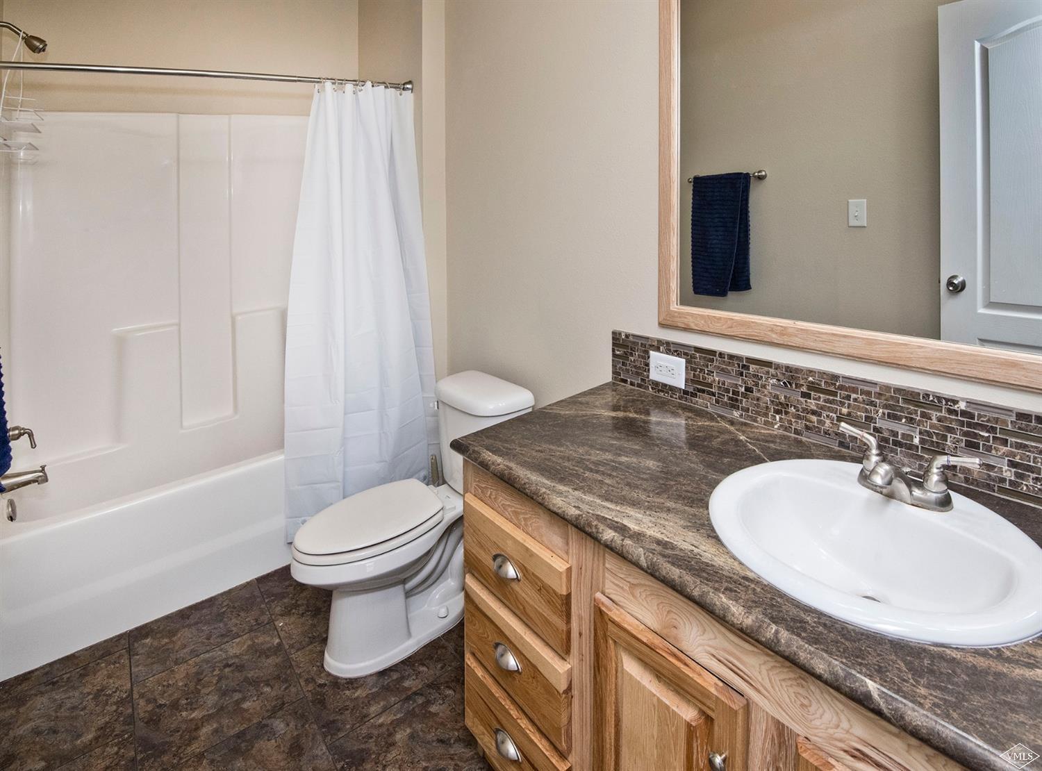 10 Salmon Loop Gypsum, CO 81637 - Photo 15 of 25 a bathroom with a granite countertop sink toilet and shower