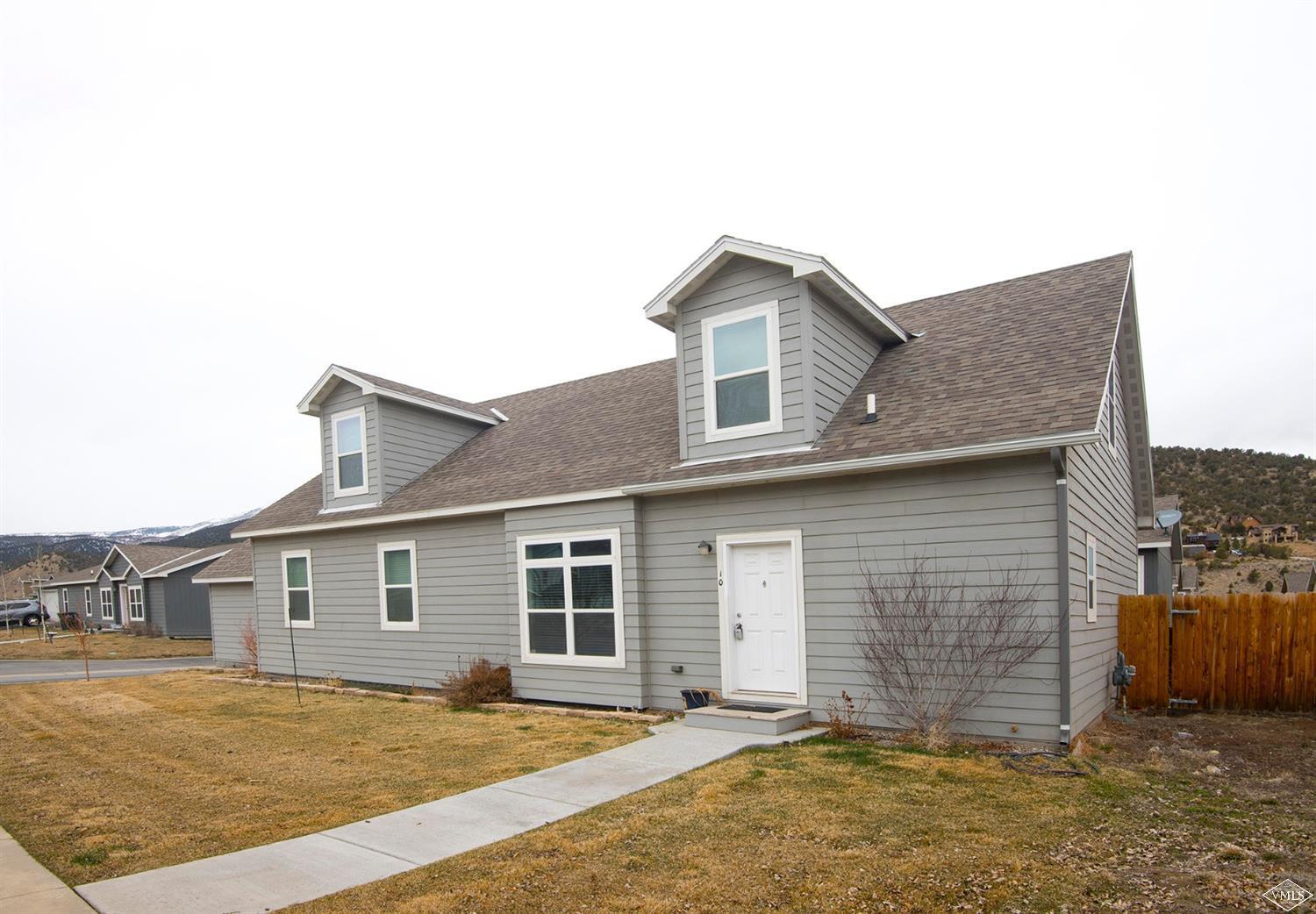 10 Salmon Loop Gypsum, CO 81637 - Photo 21 of 25 a front view of a house with a yard