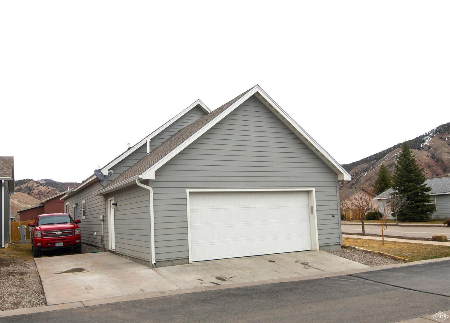 10 Salmon Loop Gypsum, CO 81637 - Photo 23 of 25 a front view of a house with a garage