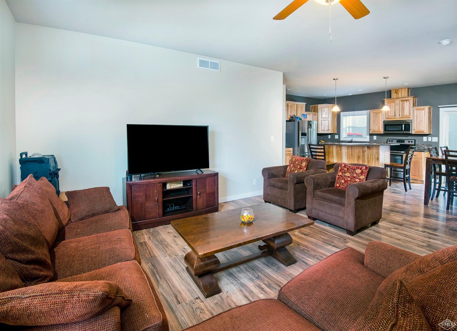 10 Salmon Loop Gypsum, CO 81637 - Photo 3 of 25 a living room with furniture and a flat screen tv
