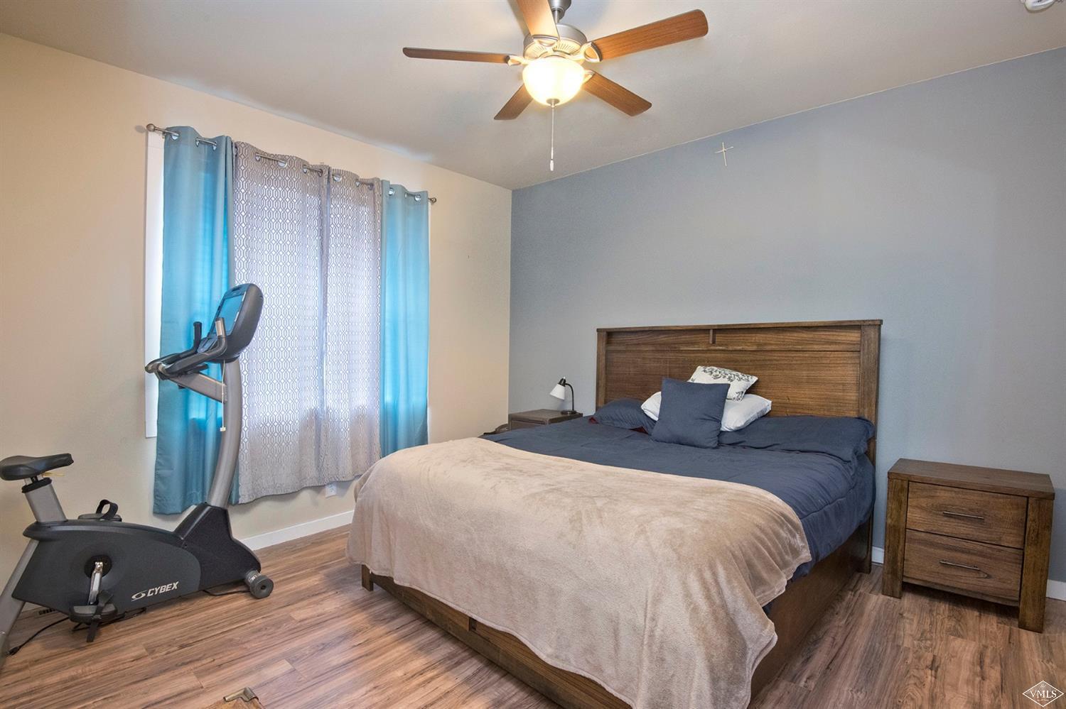 10 Salmon Loop Gypsum, CO 81637 - Photo 8 of 25 a bedroom with a bed and wooden floor