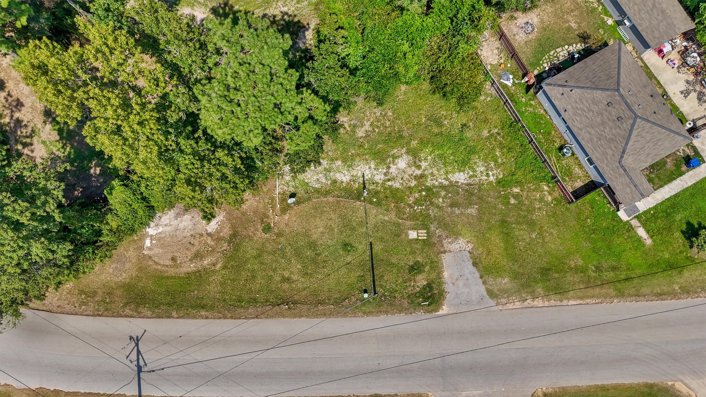 17023 Main Street Splendora, TX 77372 - Photo 4 of 9 a view of a yard