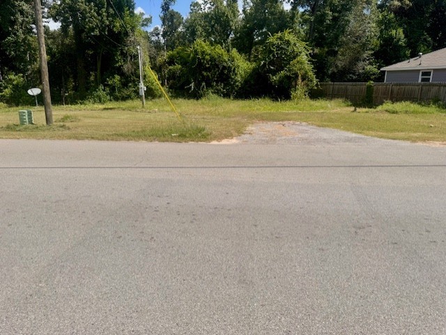 17023 Main Street Splendora, TX 77372 - Photo 7 of 9 a view of a yard with a trampoline