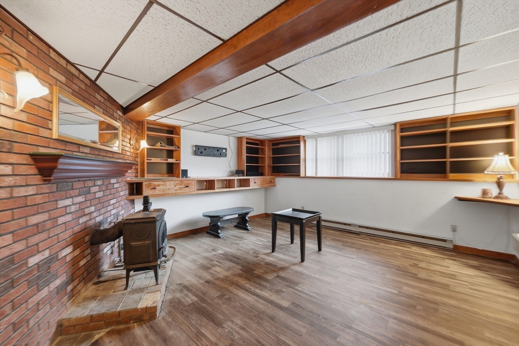 128 Derby Street Worcester, MA 01604 - Photo 11 of 34 a living room with furniture a window and wooden floor