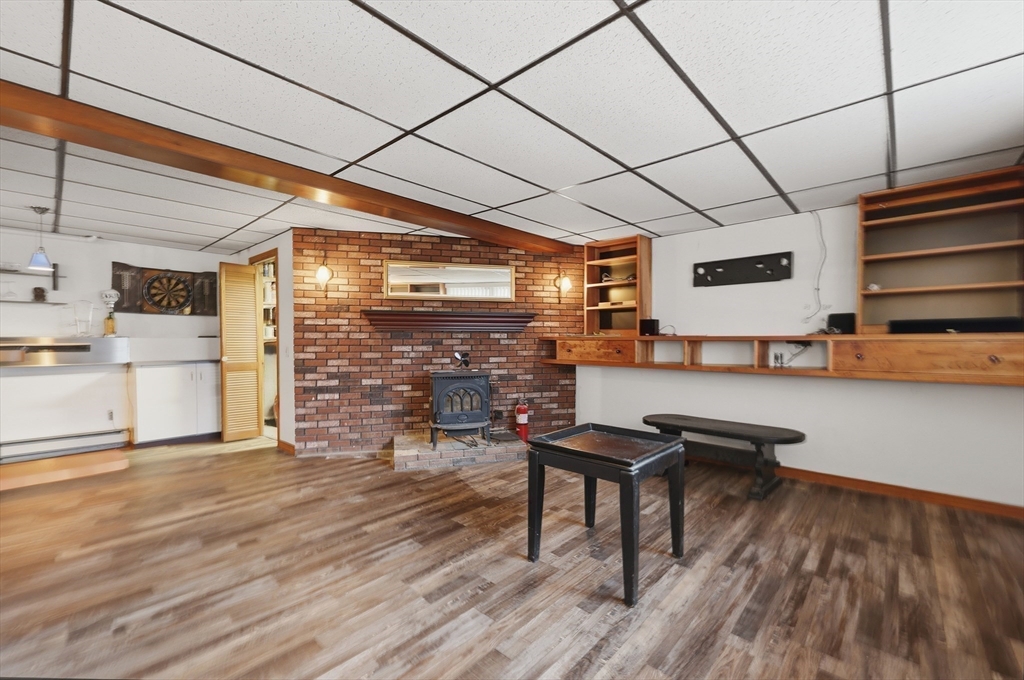 128 Derby Street Worcester, MA 01604 - Photo 12 of 34 a room with furniture and a wooden floor