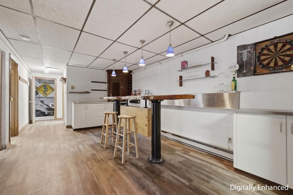 128 Derby Street Worcester, MA 01604 - Photo 14 of 34 a room with furniture and wooden floor