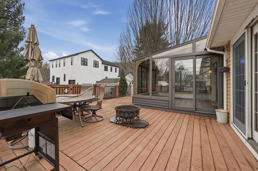 128 Derby Street Worcester, MA 01604 - Photo 26 of 34 a view of a chairs and table on the wooden deck