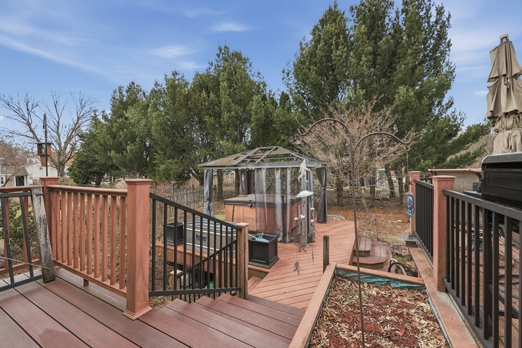 128 Derby Street Worcester, MA 01604 - Photo 28 of 34 a balcony with wooden floor and outdoor space
