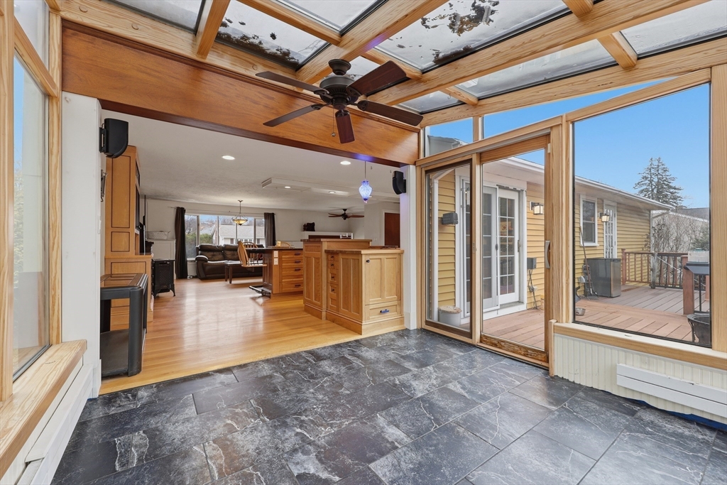 128 Derby Street Worcester, MA 01604 - Photo 7 of 34 a view of a hall with an entryway and wooden floor