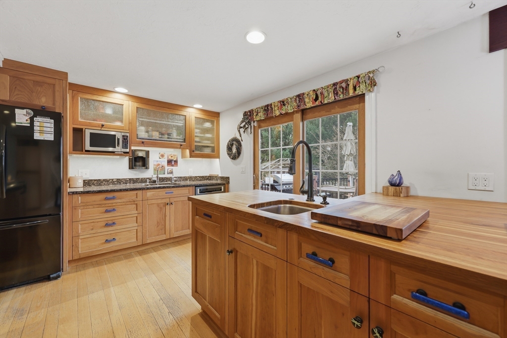 128 Derby Street Worcester, MA 01604 - Photo 8 of 34 a kitchen with a sink stove and cabinets