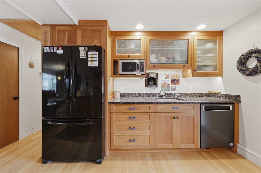 128 Derby Street Worcester, MA 01604 - Photo 10 of 34 a kitchen with granite countertop a refrigerator and a sink