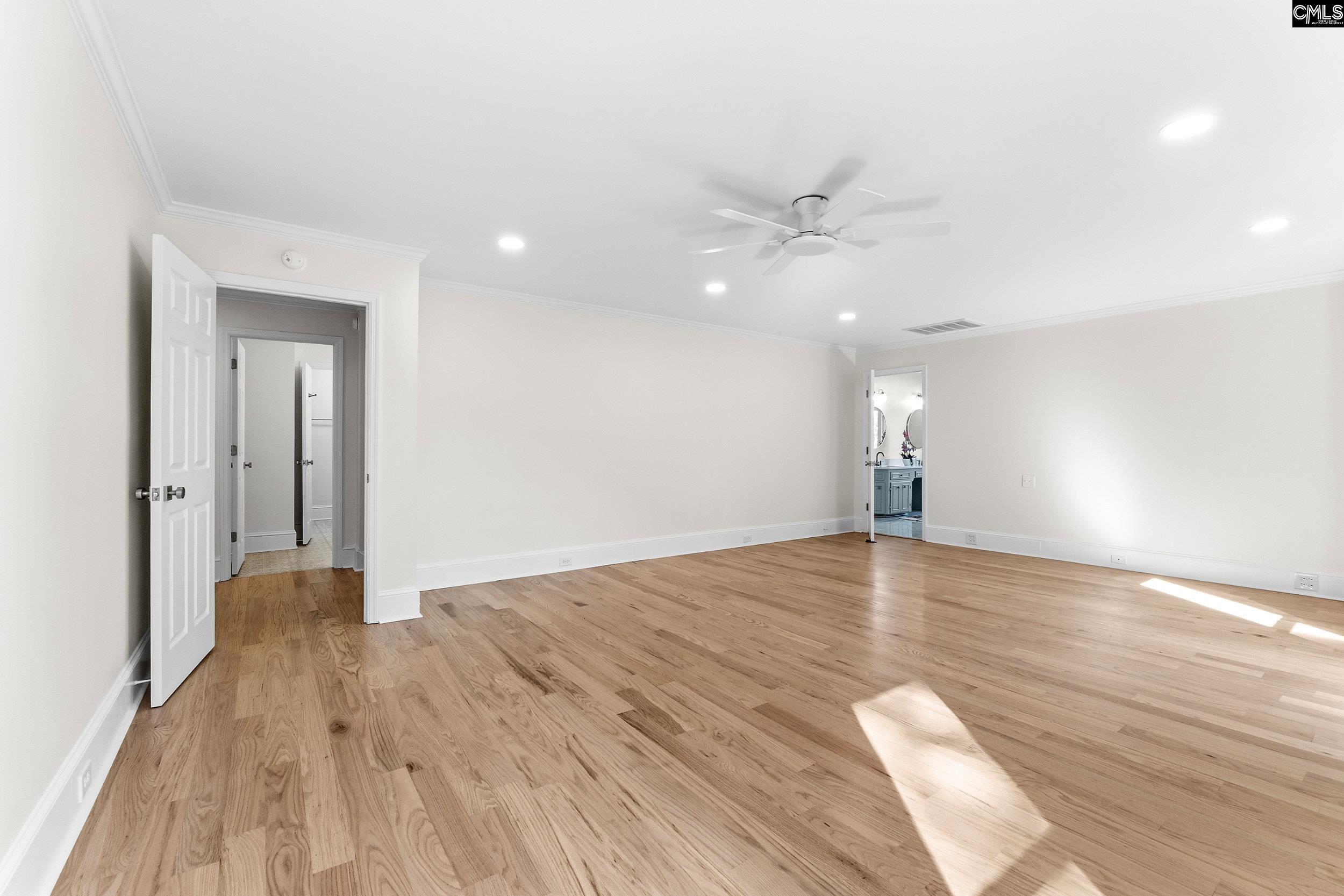 121 Silver Lake Road East Columbia, SC 29223 - Photo 35 of 57 a view of empty room with wooden floor and fan