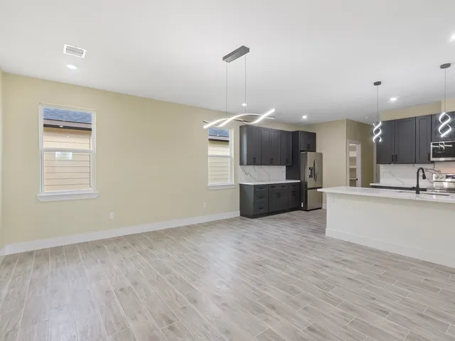 a view of kitchen with furniture and wooden floor