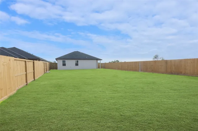 a house view with swimming pool in front of it